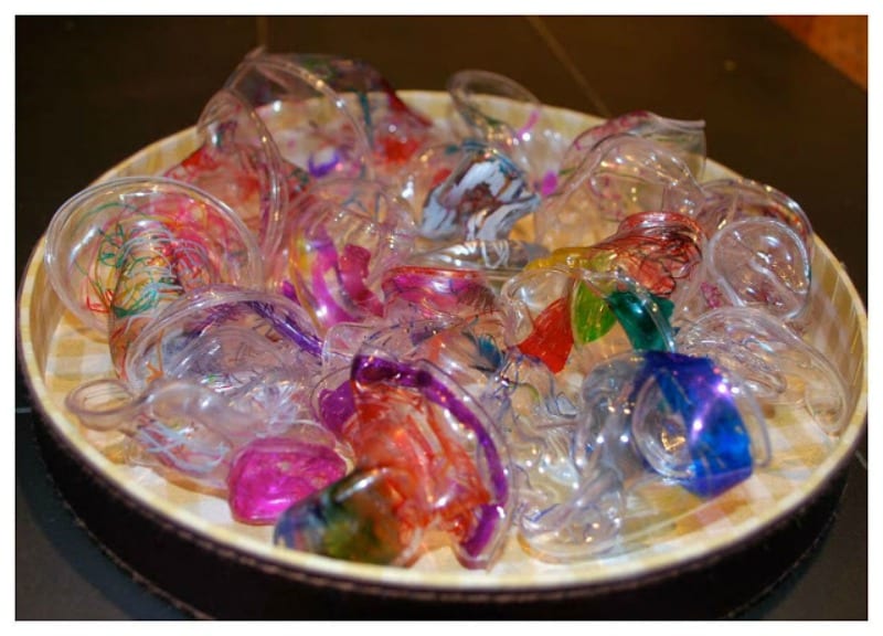 A platter holds Chihuly-style sculptures made from melted plastic cups